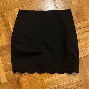 Black scalloped mini skirt